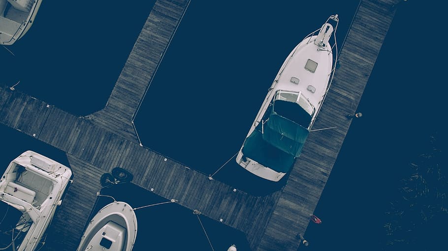 aerial photo of white yacht near wooden dock, white speedboat dock near wooden platforms HD wallpaper