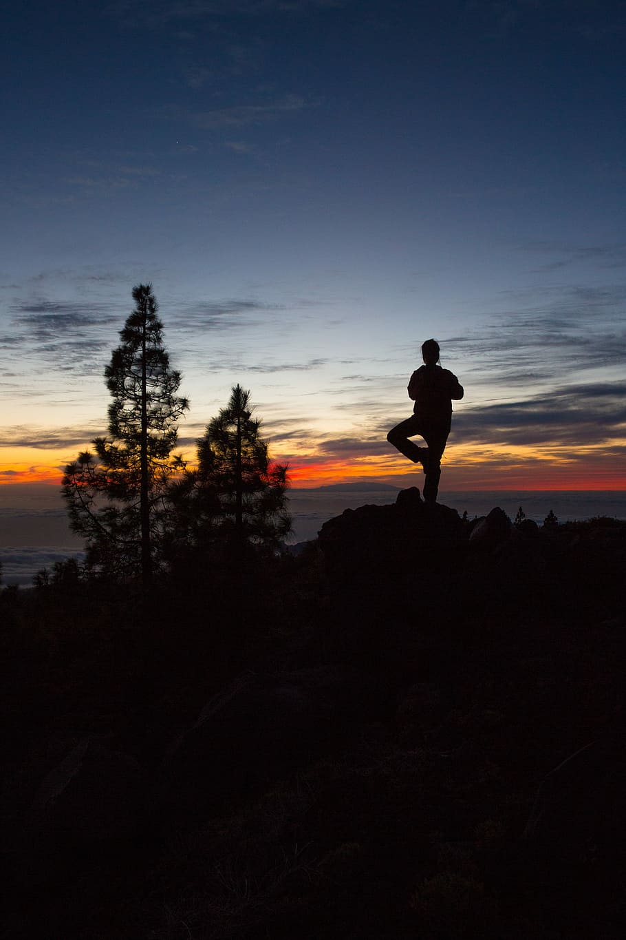 silhouette of person standing on one leg, silhouette of person doing yoga on top of rock during sunset HD wallpaper
