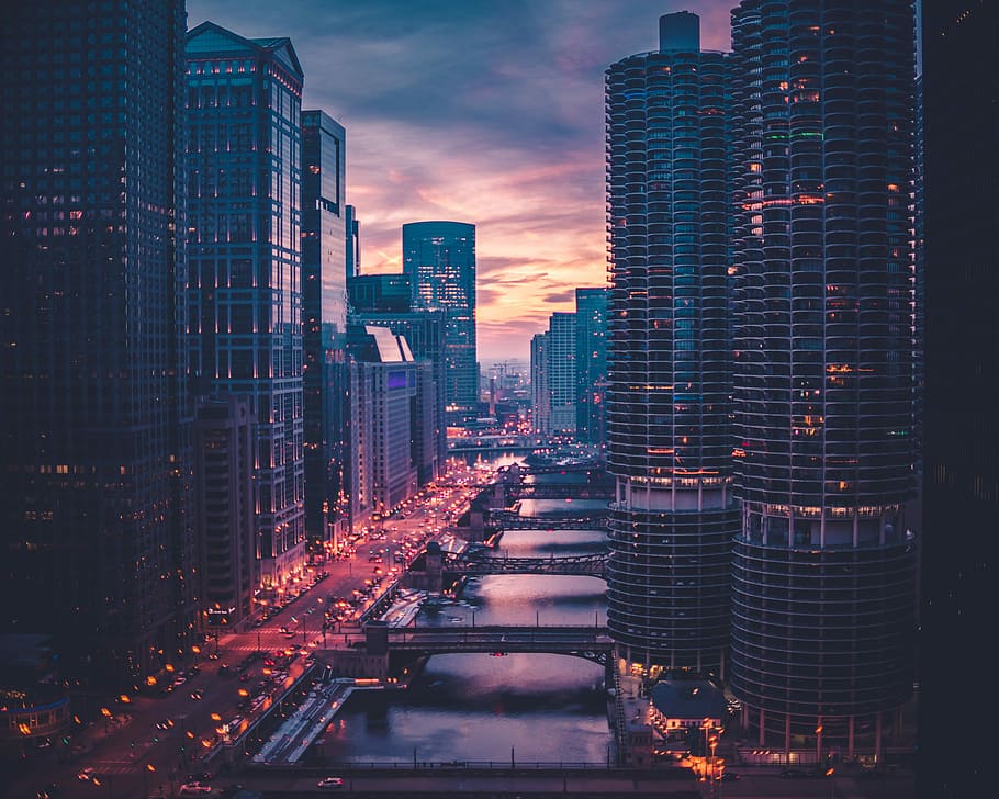 high-rise building during golden hour, assorted buildings beside hiway road HD wallpaper