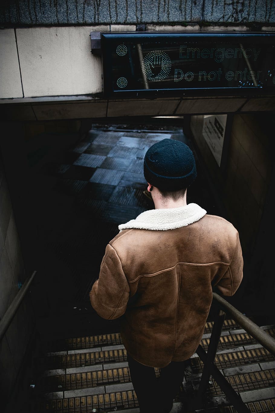 man walking downstairs, beanie, back, guy, people, floor, checkered HD wallpaper