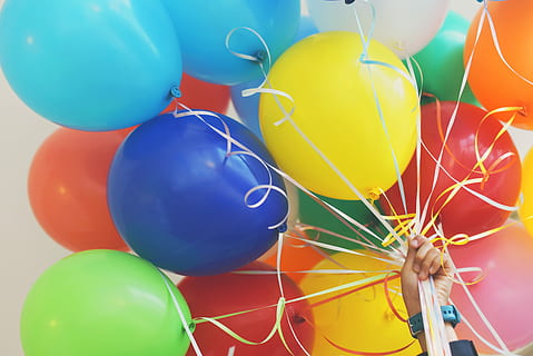 person holding balloons, person holding party balloon lot, strings HD wallpaper