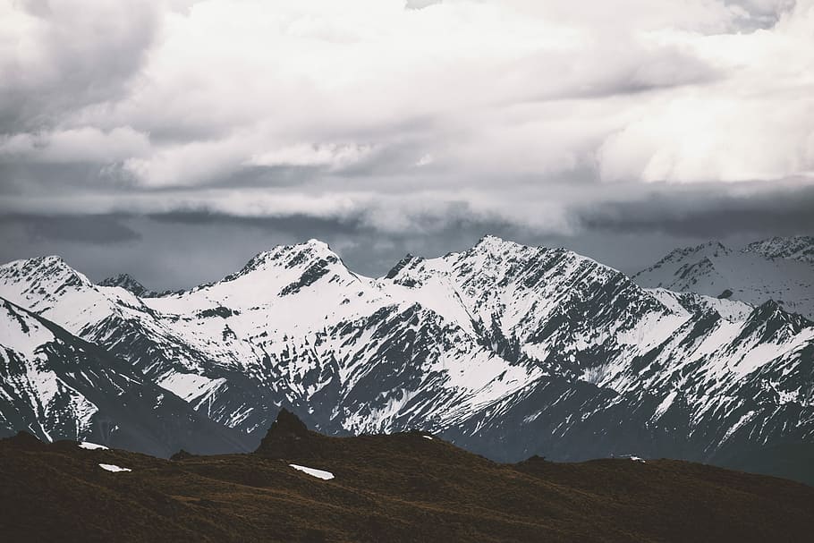 selective focus photography of mountain covered by snow, white snow on black mountain HD wallpaper