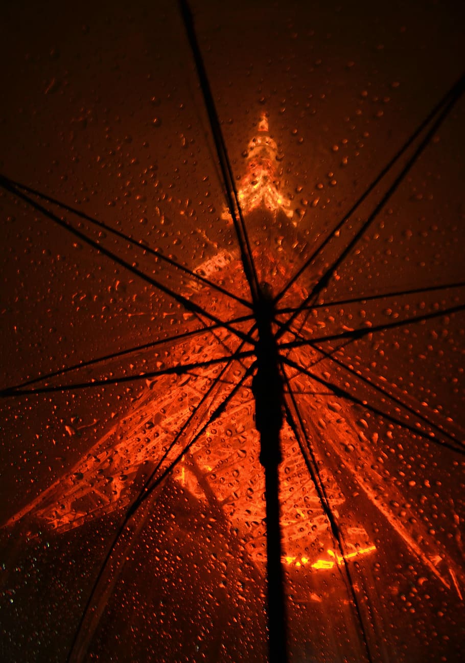 orange umbrella with drops, umbrella with water drops, night