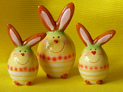 three yellow-red-and-white ceramic bunny figurines, hare, easter bunny HD wallpaper