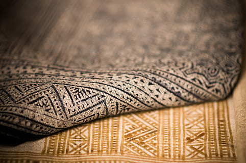 A close up that shows the texture of two different patterned rugs, untitled HD wallpaper
