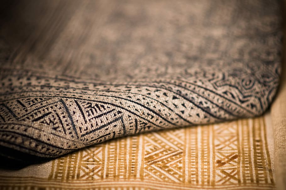 A close up that shows the texture of two different patterned rugs, untitled HD wallpaper