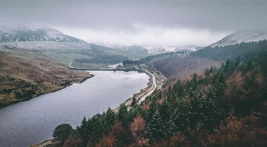 aerial view photography of calm body of water, river between hills HD wallpaper
