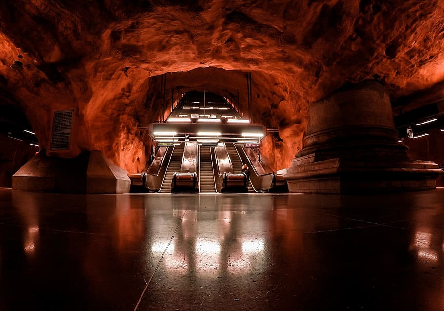 Swedish subway, escalator in red concrete building, night, dark HD wallpaper