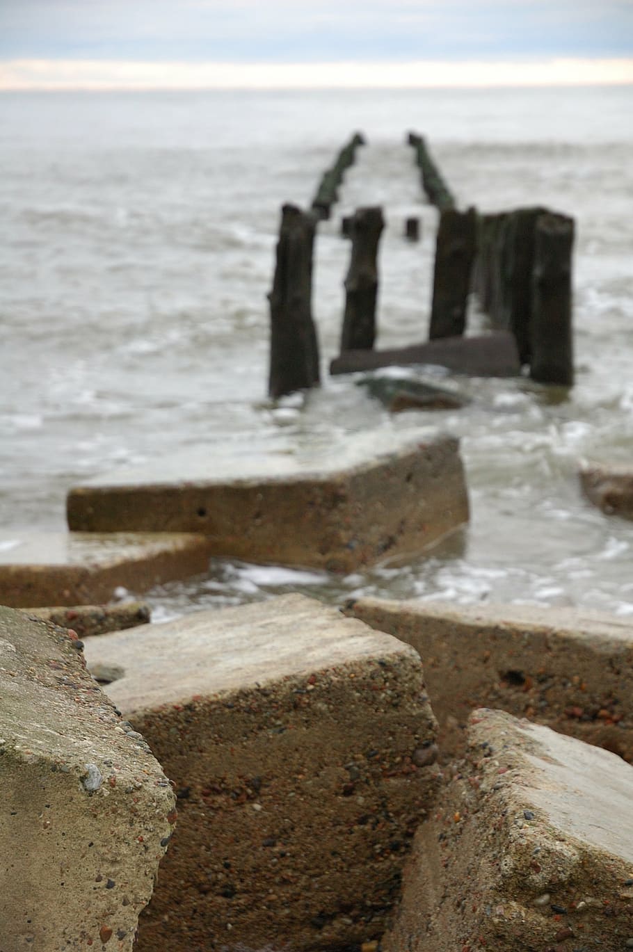 breakwaters, sea, rocks, beach, stone, nature, wave, land, sky HD wallpaper