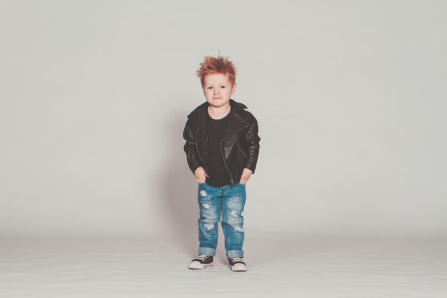 boy standing near white wall, baby, perfecto, rock, punk, leather jacket