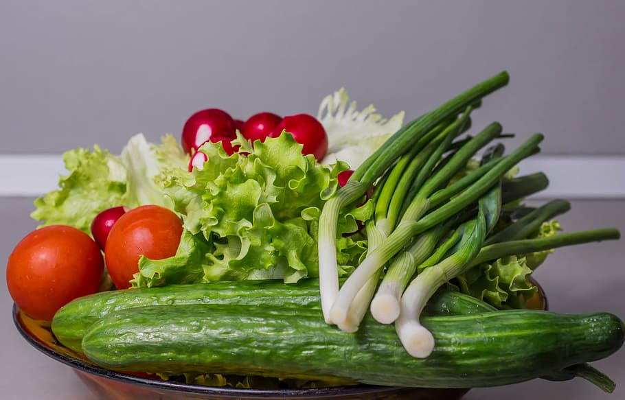 selective focus photography of vegetables, cucumber, onion, salad