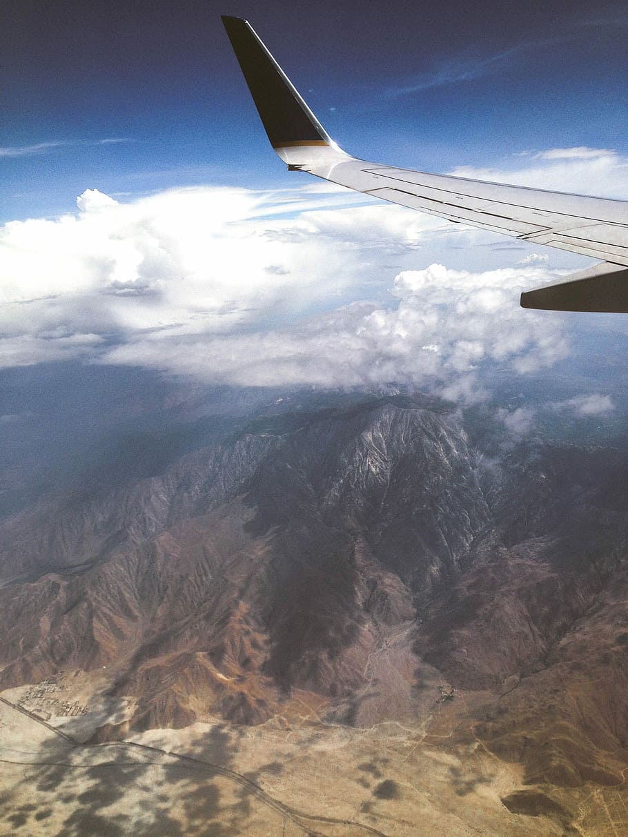 Above the mountains, aerial photography of mountain under white thick clouds HD wallpaper