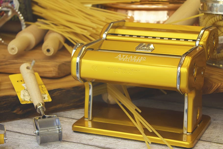 brass-colored pasta maker on white wooden surface, machine HD wallpaper