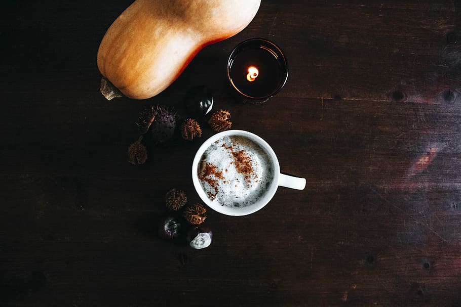 coffee cup near orange vegetable on brown wooden surface, white ceramic mug beside orange pumpkin on top of brown wooden surface HD wallpaper