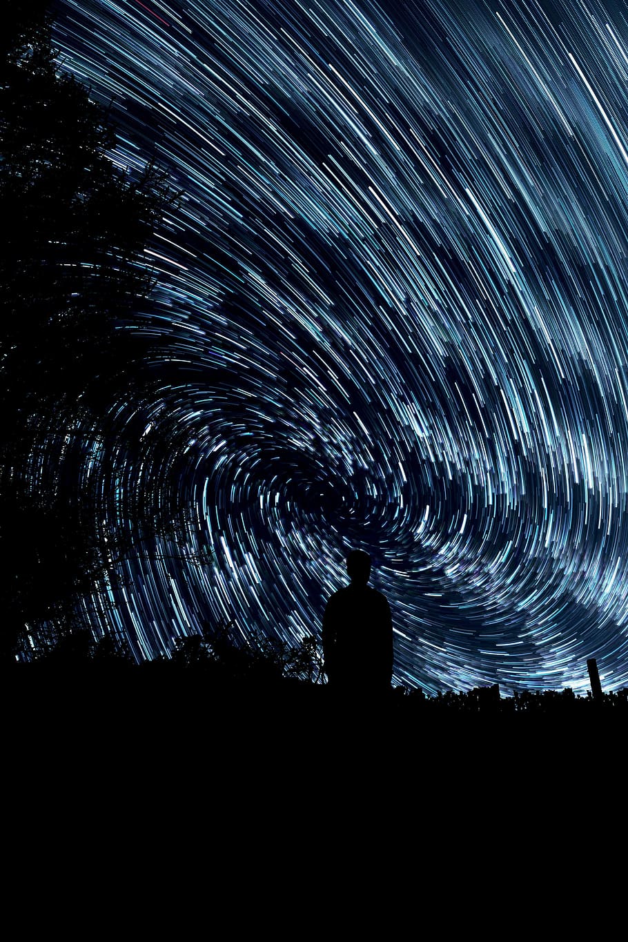 silhouette of man standing neat trail of stars, swirling light HD wallpaper