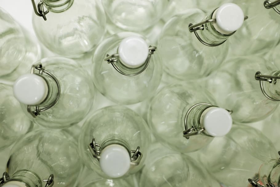 high angle photo of swing top bottles, clear glass bottle lot HD wallpaper