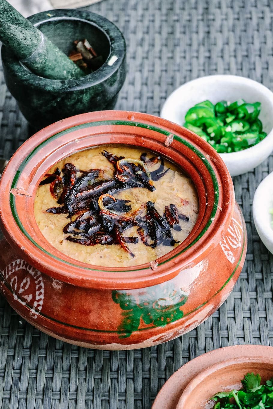 Haleem, brown clay pot with food, stew, chilli, meal, peppers