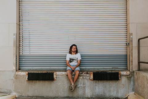 people, guy, man, sitting, alone, one person, young adult, front view HD wallpaper
