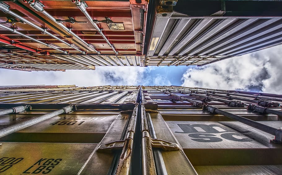 worm's eye view of freight containers, port, loading, stacked