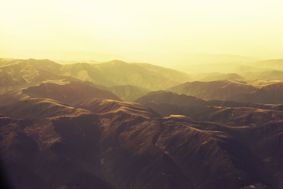 valley during sunset, birds eye view of brown rock formation mountins HD wallpaper