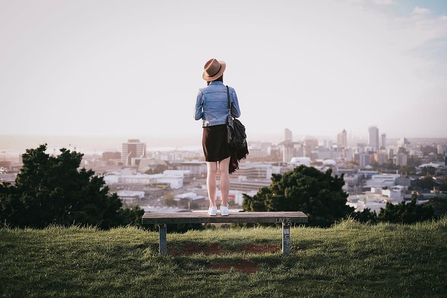 woman standing on brown bench, architecture, building, infrastructure HD wallpaper