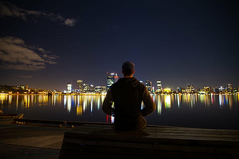 HD wallpaper: Man sitting on a window sill, looking out at night