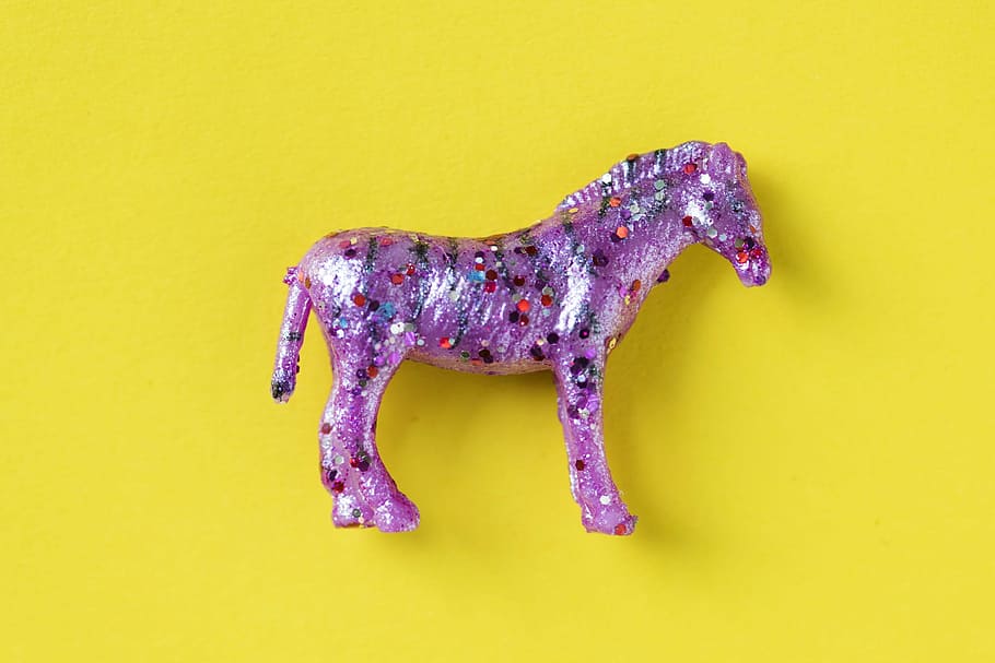 purple plastic toy, animal, nature, aerial, background, bedazzled