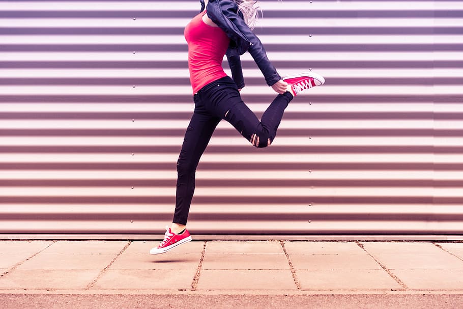 Young Happy Woman Jumping in Front of Metal Wall, colorful, emotions, HD wallpaper