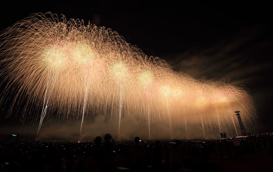 yellow fireworks above a city during night time, fireworks during nighttime HD wallpaper