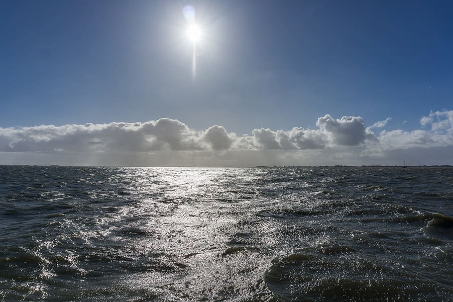 sun, clouds, rain, water, sun rays, nature, air, sea, sky, beauty in nature HD wallpaper