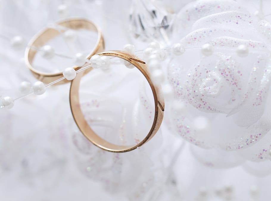 pair of gold-colored bangle bracelets near flower decor, ring HD wallpaper