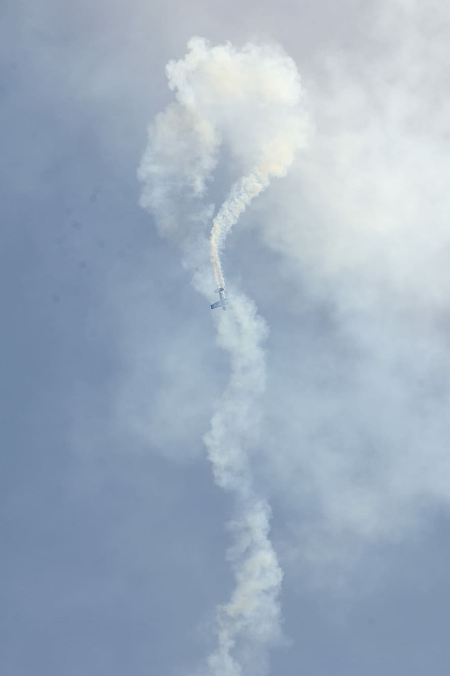 biplane bursting white smoke on air, aerobatic plane covered with contrails HD wallpaper