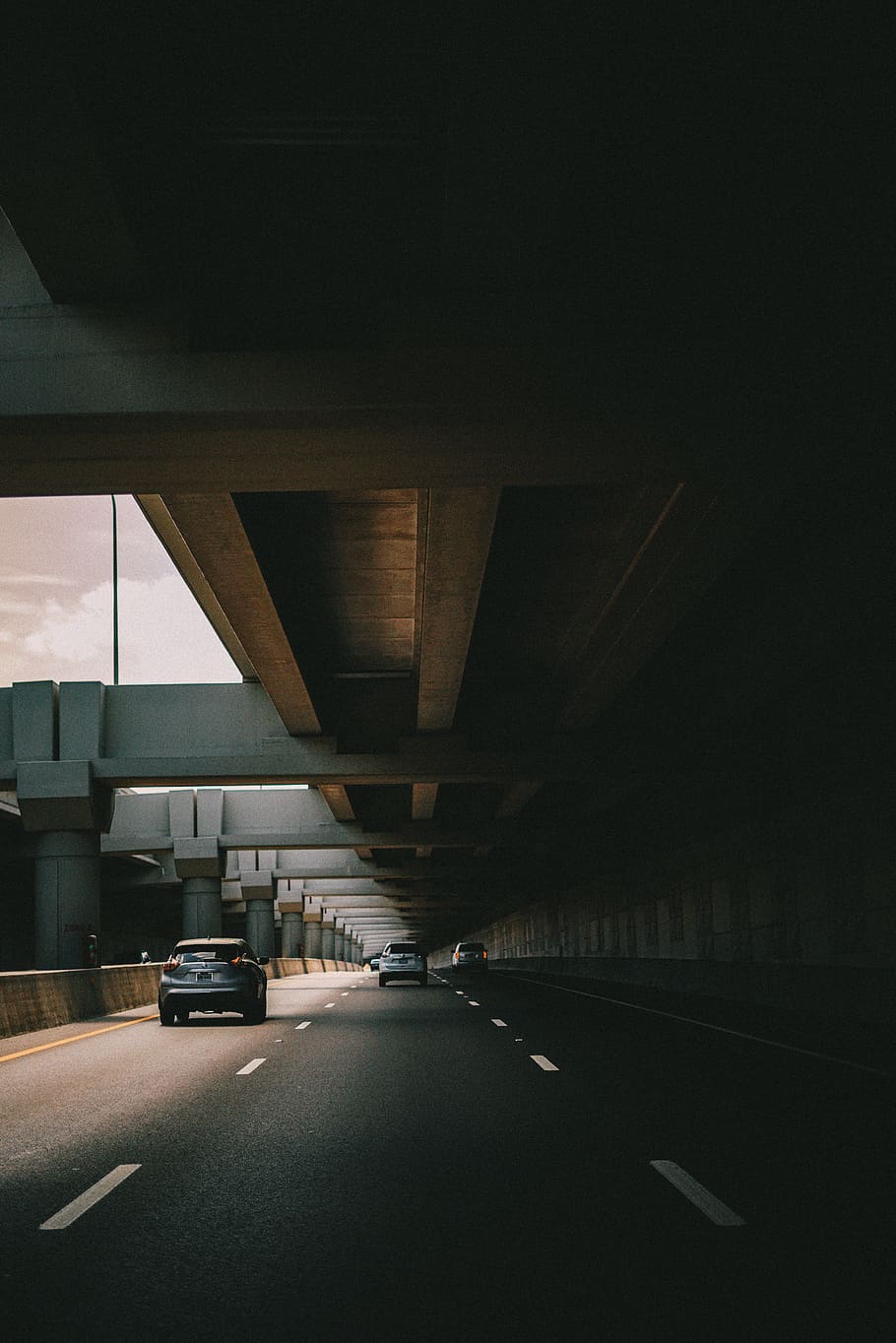 running vehicles on road under bridge, road with cars with concrete structure above HD wallpaper