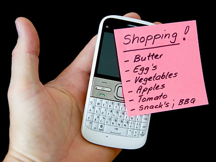person holding QWERTY phone and pink card, hand, mobile, note HD wallpaper