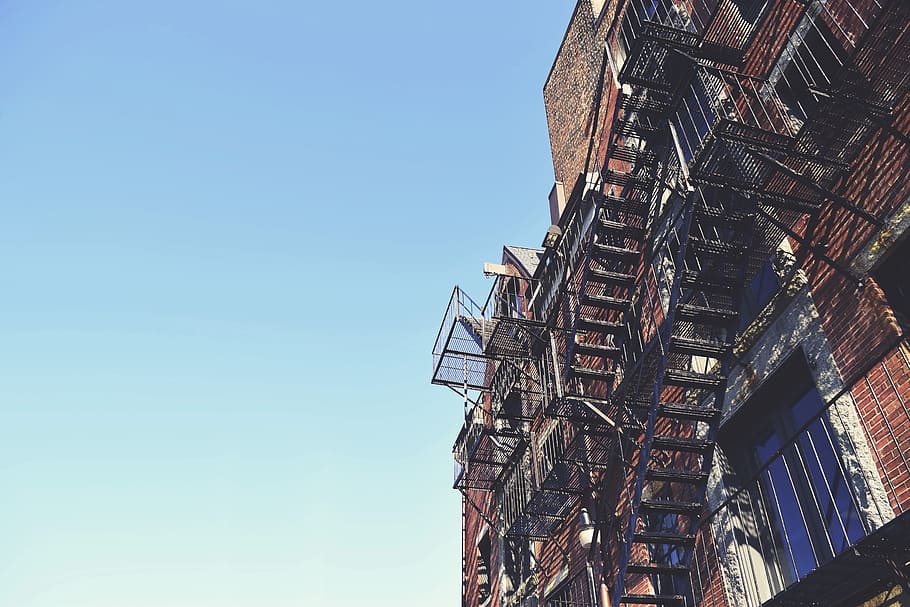 worm's eye view photography of black metal staircase at the building, establishment with metal emergency stairs HD wallpaper