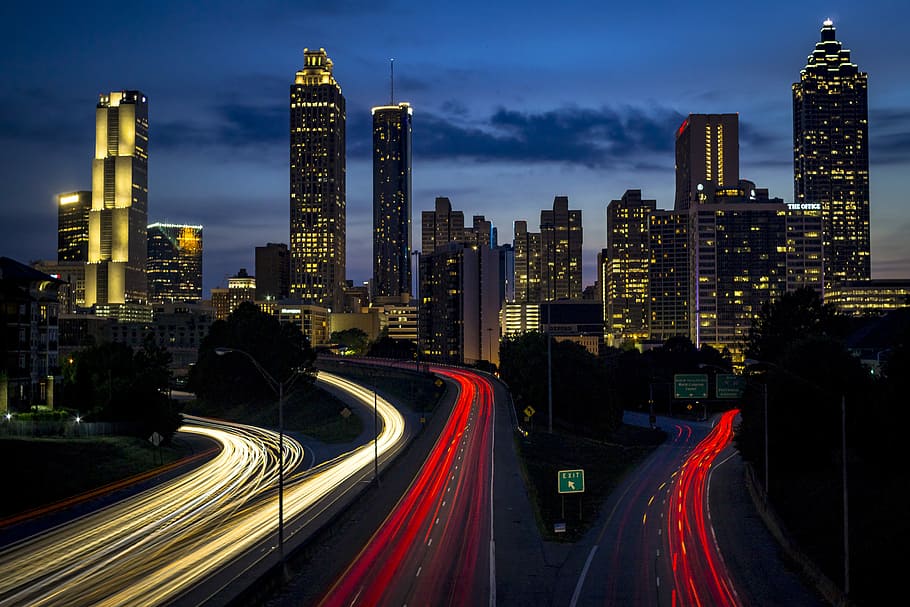 city building during night, time lapse photography of car light HD wallpaper