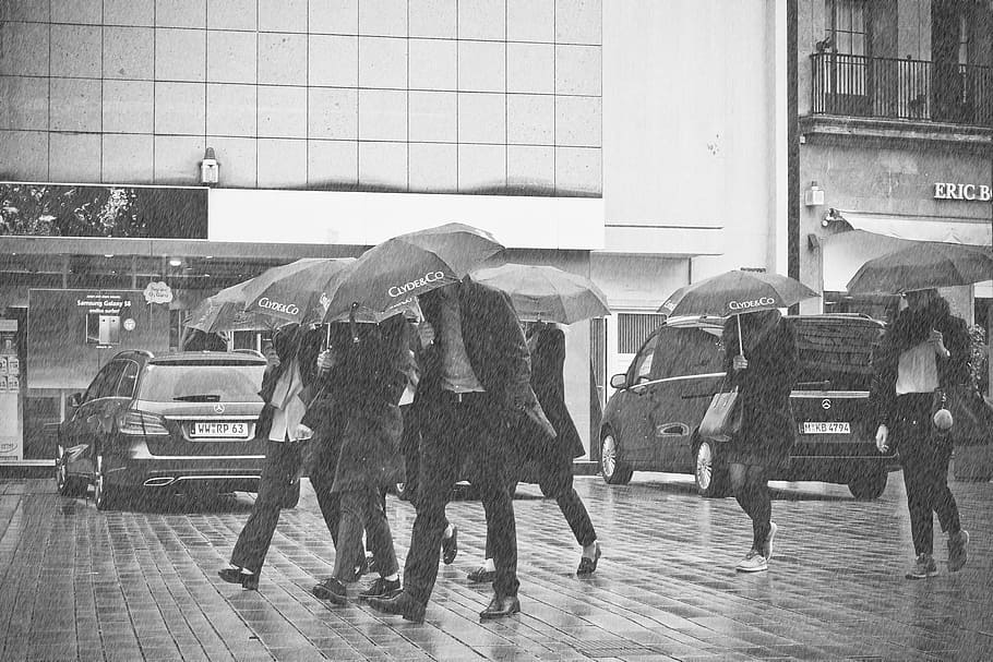 grayscale photography of people walking on concrete pavement HD wallpaper