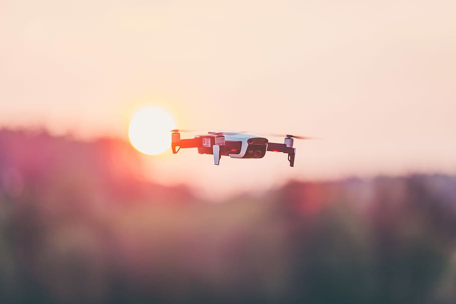 black and white quadcopter drone, flying quadrone in the sky selective focus photography HD wallpaper