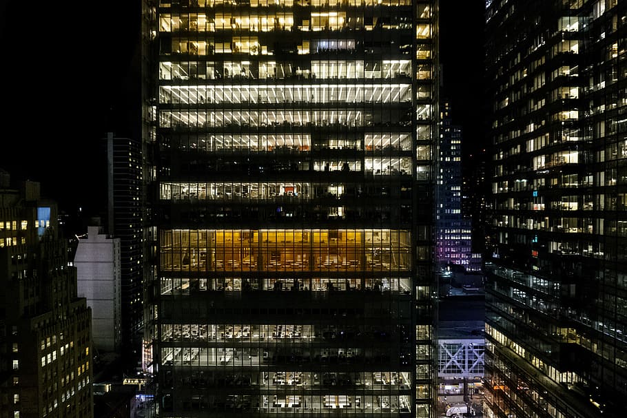 aerial photography of city buildings during nighttime, photo of high rise buildings during nighttime HD wallpaper