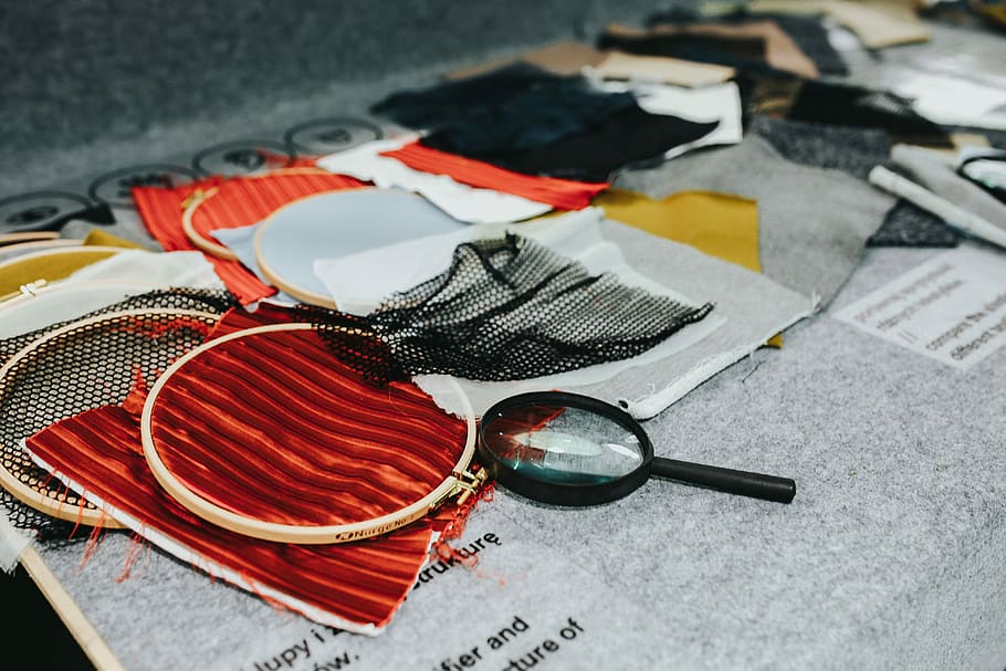 Magnifying glass with fabric on a table, material, cloth, textile