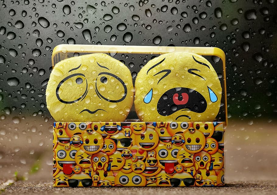 two yellow emoji plush toys, cry, bad weather, rain, drip, smilies