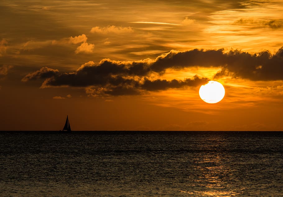 body of water during golden hour, sunset, clouds, sea, boot HD wallpaper