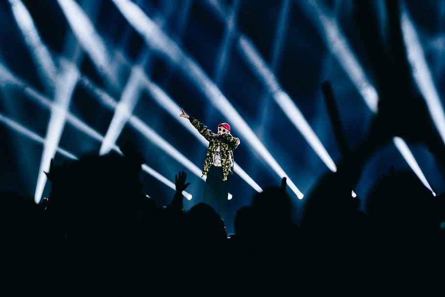 man performing on stage, person standing on stage while performing HD wallpaper