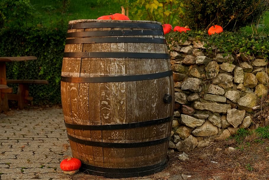 photo of brown and black wooden barrel, wine barrel, wooden barrels