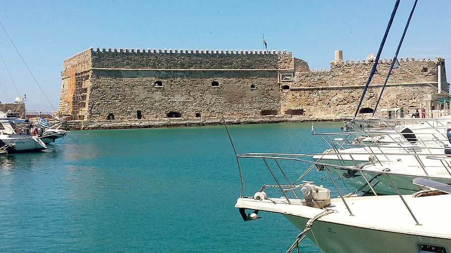 beige concrete building beside body of water under blue sky, heraklion, HD wallpaper