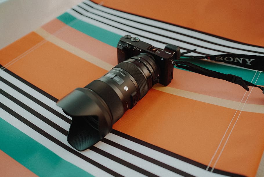 black Sony point-and-shoot camera with black zoom lens, black Sony DSLR camera HD wallpaper