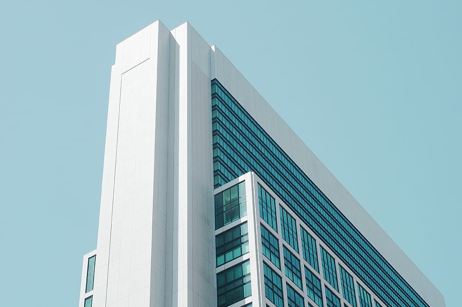 low-angle photography of white concrete framed curtain-wall high-rise building under blue sky, HD wallpaper