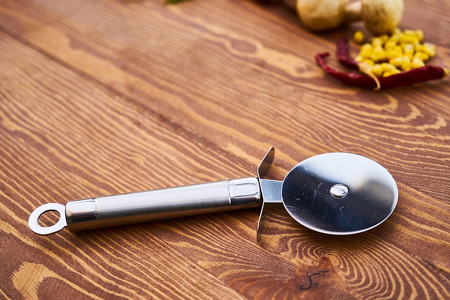 round silver food slicer on table, pizza, hack, knife, circle HD wallpaper