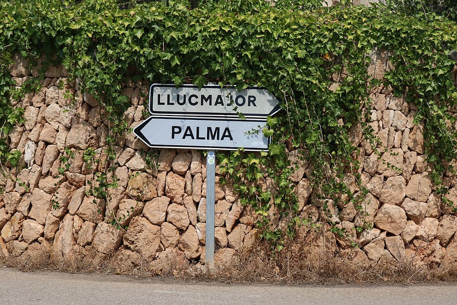 mallorca, street sign, shield, traffic sign, stone wall, tanca-wall