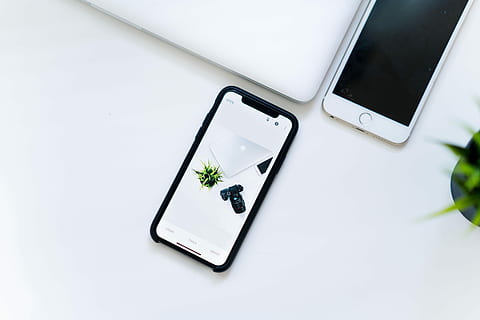 space gray iPhone X, space gray iPhone X displaying silver MacBook beside DSLR camera HD wallpaper